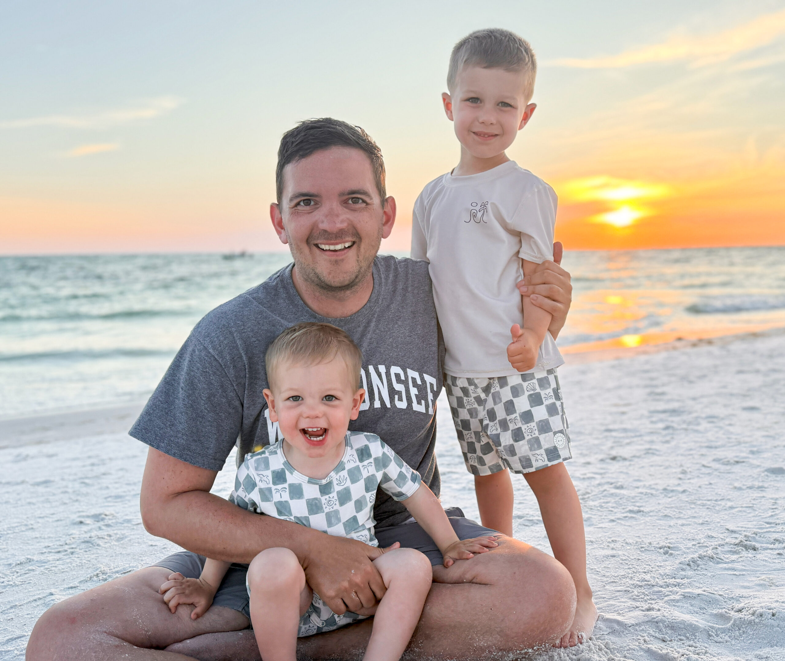 Justin on the beach with his sons
