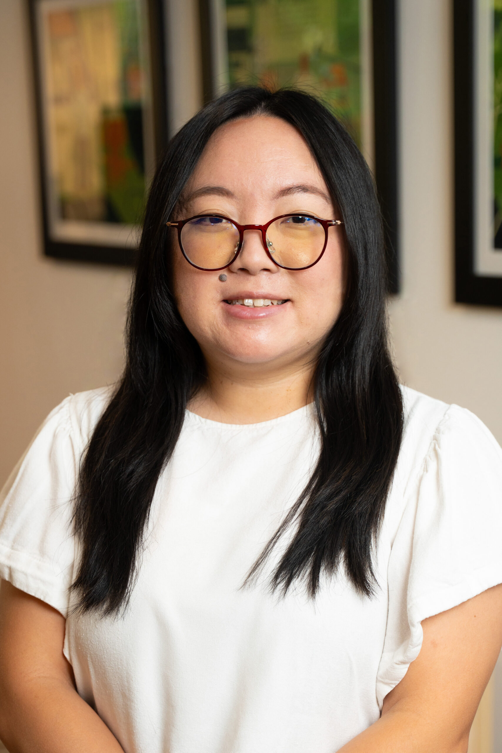 professional headshot of a woman with glasses